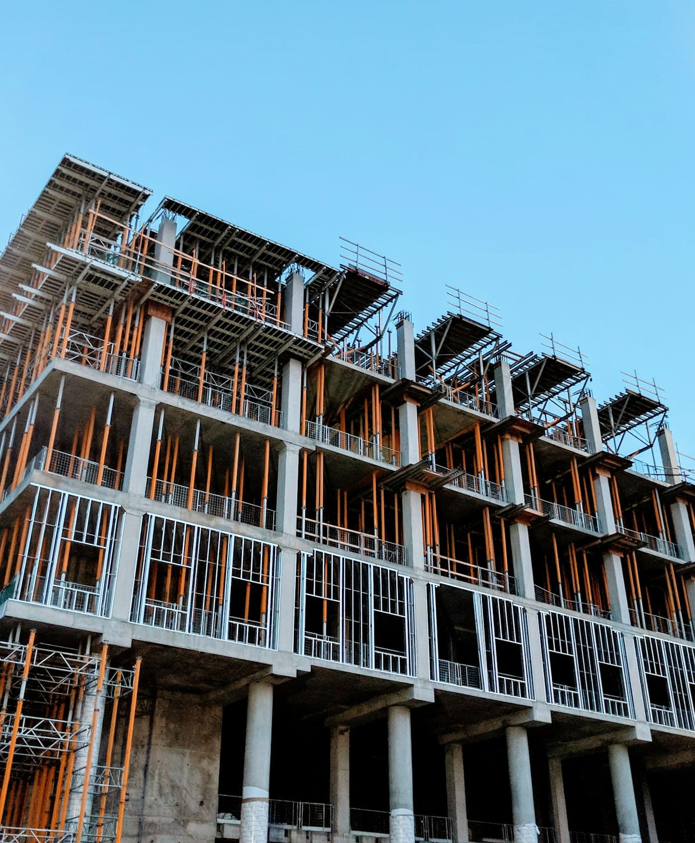 Building under construction with timber formwork across several floors